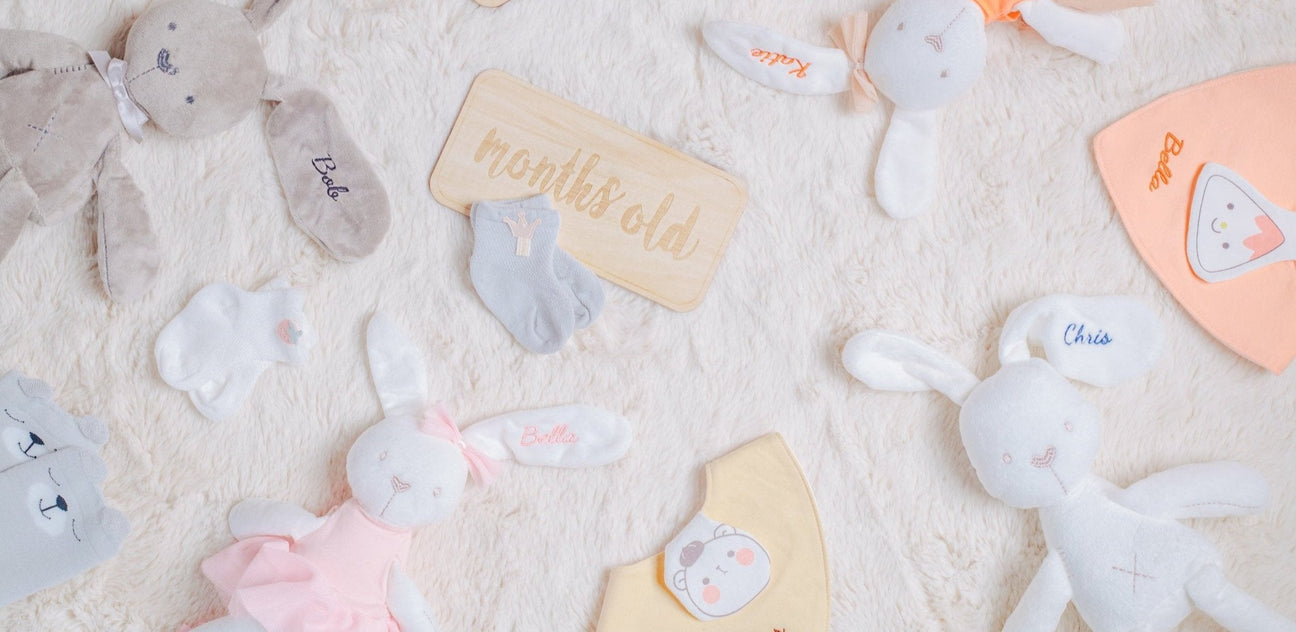 a bunch of personalised baby gifts (plushie, baby bibs, baby socks, etc.)