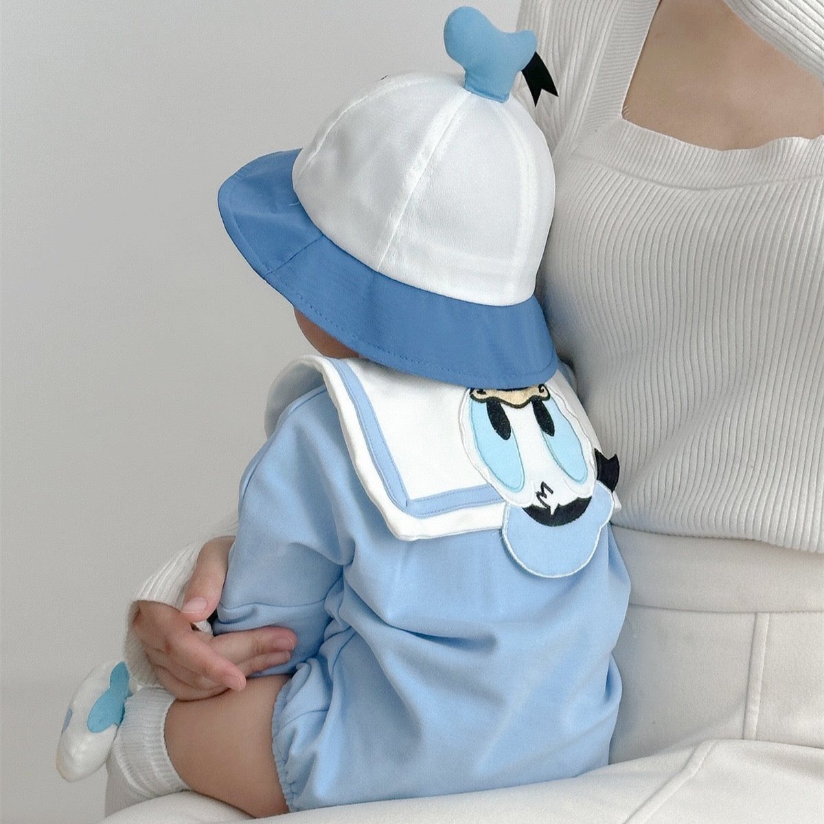 Baby wearing Little Ducky romper – unisex baby outfit from premium gift set