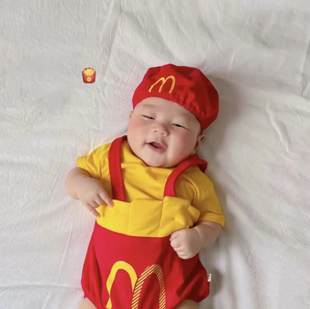 Baby wearing the Mc Kidz fries-inspired romper with matching hat and socks