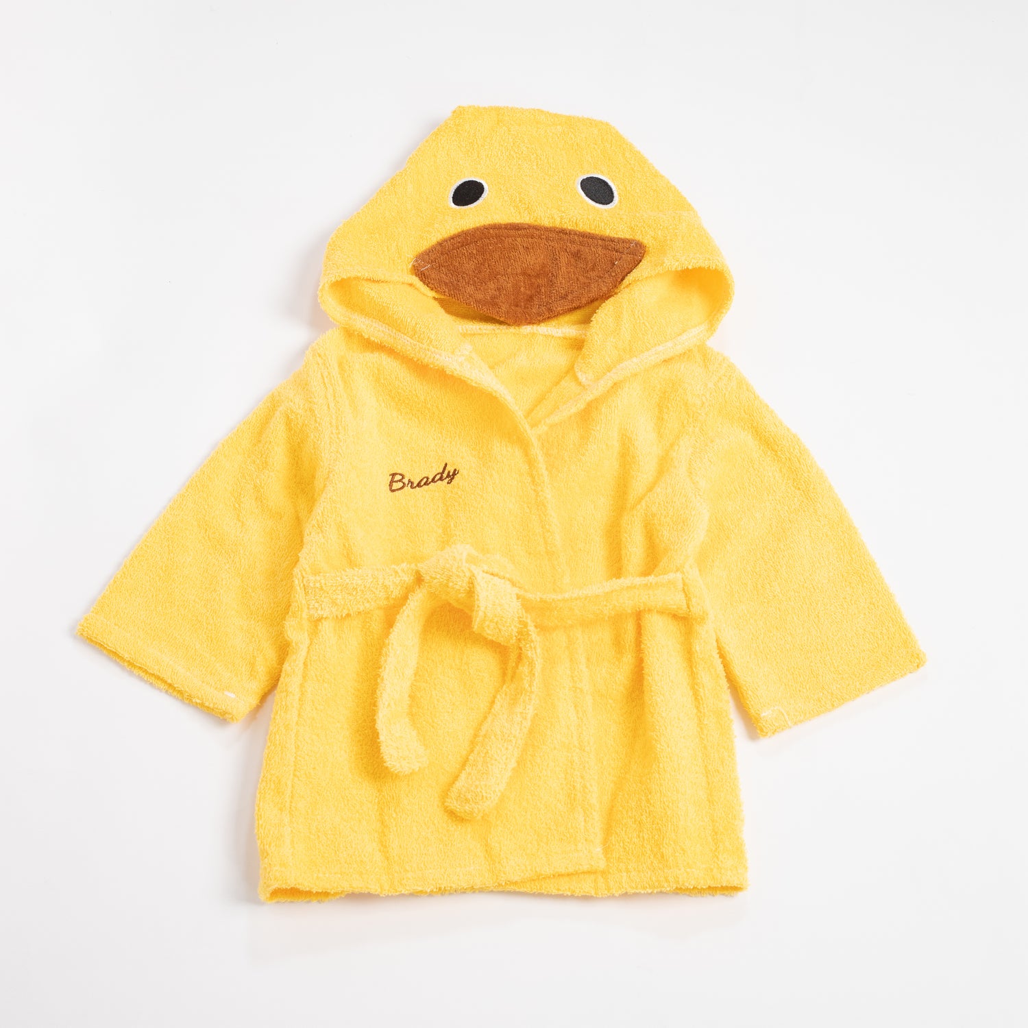 Flat lay of a yellow duck bathrobe with the name &
