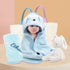 A newborn baby wearing a blue puppy hooded bath towel, surrounded by blue soft toys and a blue fleece blanket. The fleece blanket and soft toys feature embroidered names. Displaying a delightful newborn baby hamper.
