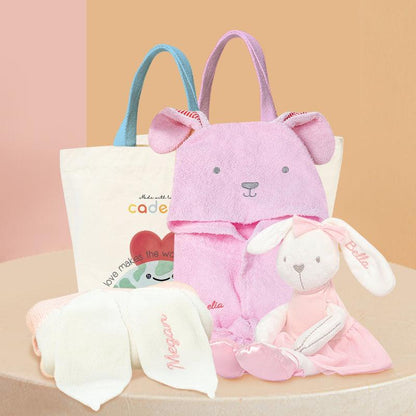Baby Hamper - Bunny Adventure Gift Set: A pink bunny bathrobe, a plushie - pink ballet bunny, a pink knit blanket with embroidered name on one ear, and two canvas bags displaying Cadeaus brand packaging.