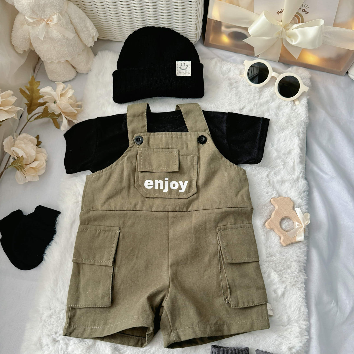 Mini Militia Green baby outfit styling – black romper with green jacket and hat
