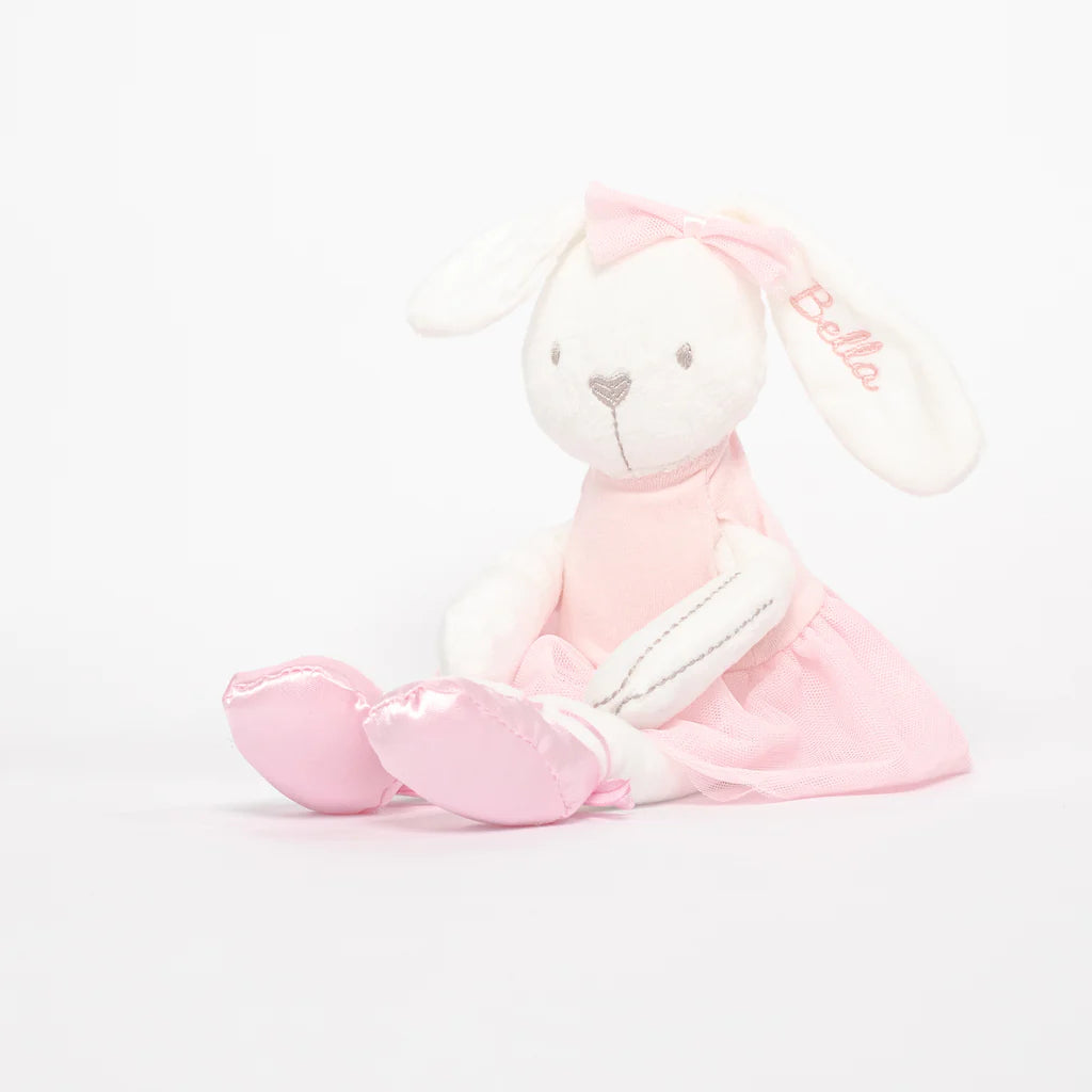 A pink ballet bunny soft toy sitting in front of a white background, elegantly displayed.