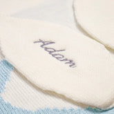 Close-up view of a white knitted bunny towel&