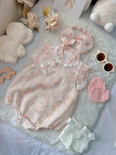 Cherry Blossom baby outfit flat lay – pink floral cheongsam-style romper with bow headband