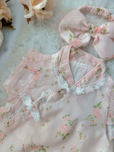 Cherry Blossom baby outfit flat lay – pink floral cheongsam-style romper with bow headband