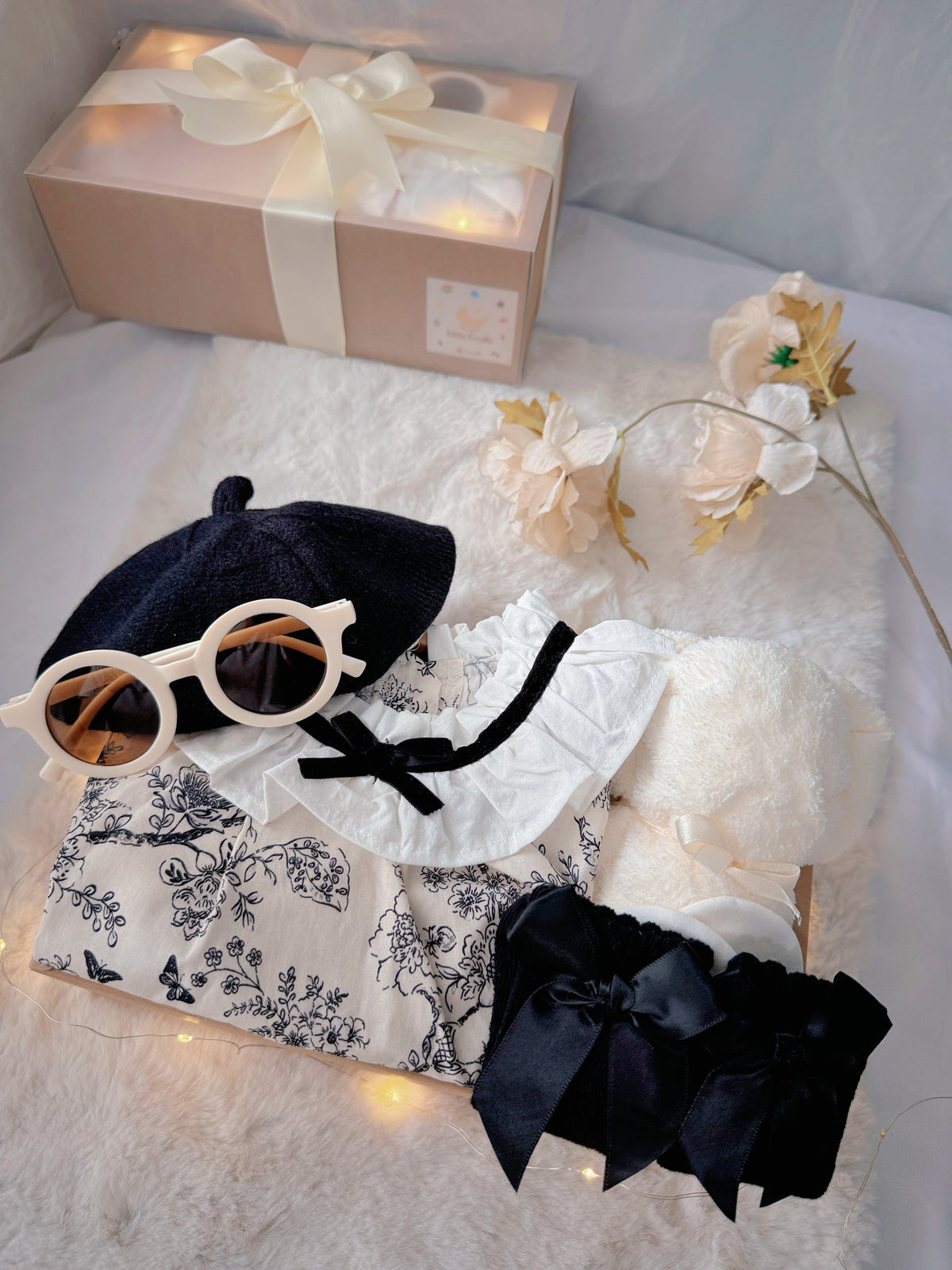 French Blossom classic baby gift box with floral romper with ruffled collar and black beret