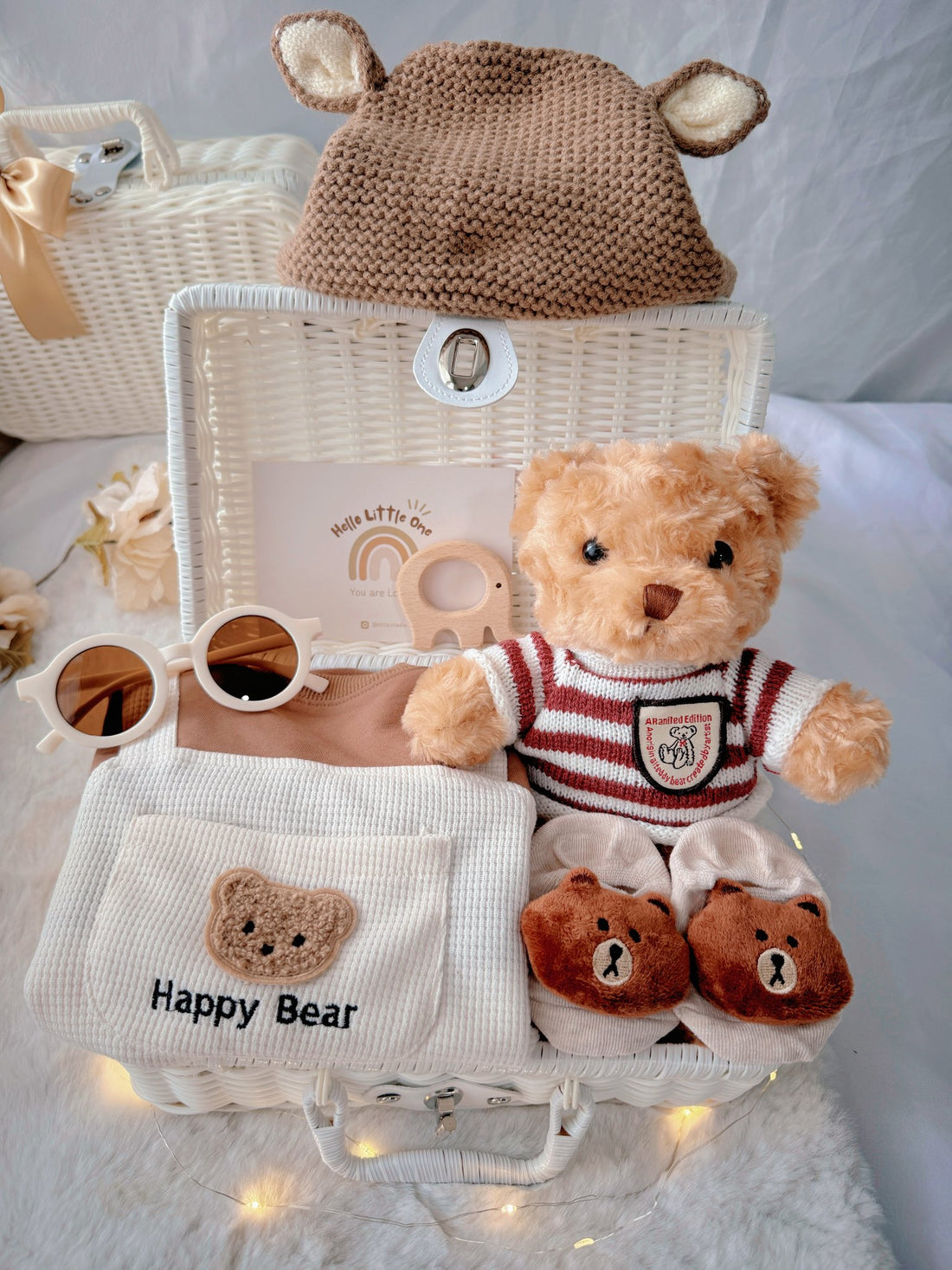 Happy Bear premium baby gift set in a rattan basket with bear overall romper with bear-ear knit hat