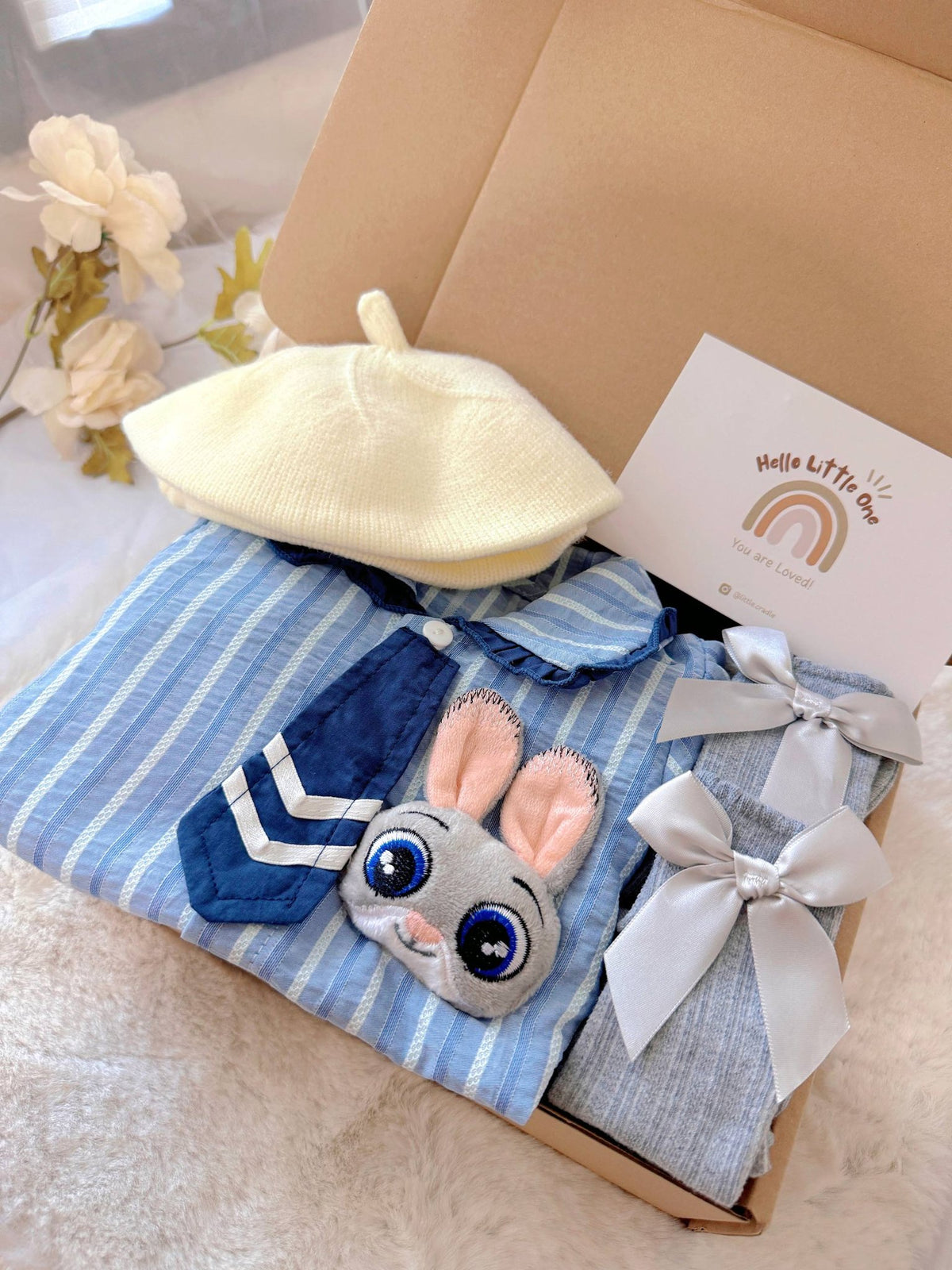 Judy Bunny standard baby gift box with blue striped romper with tie and bunny badge
