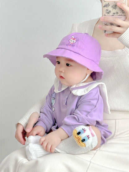 Baby wearing the Little Daisy lilac duck-collar romper with bucket hat