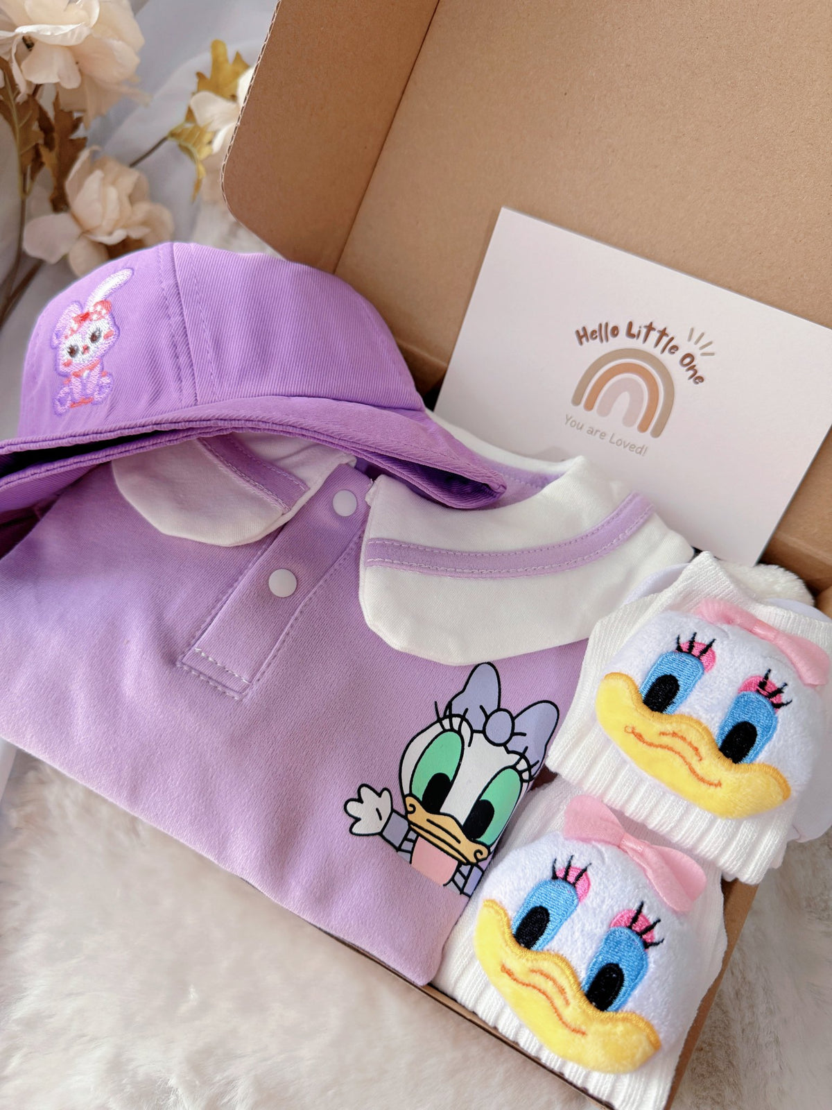 Little Daisy standard baby gift box with lilac duck-collar romper with bucket hat