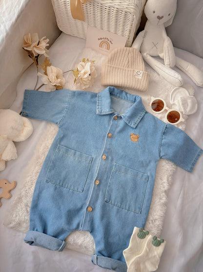 Little Denim Bear baby outfit flat lay – denim romper with bear badge and knit beanie
