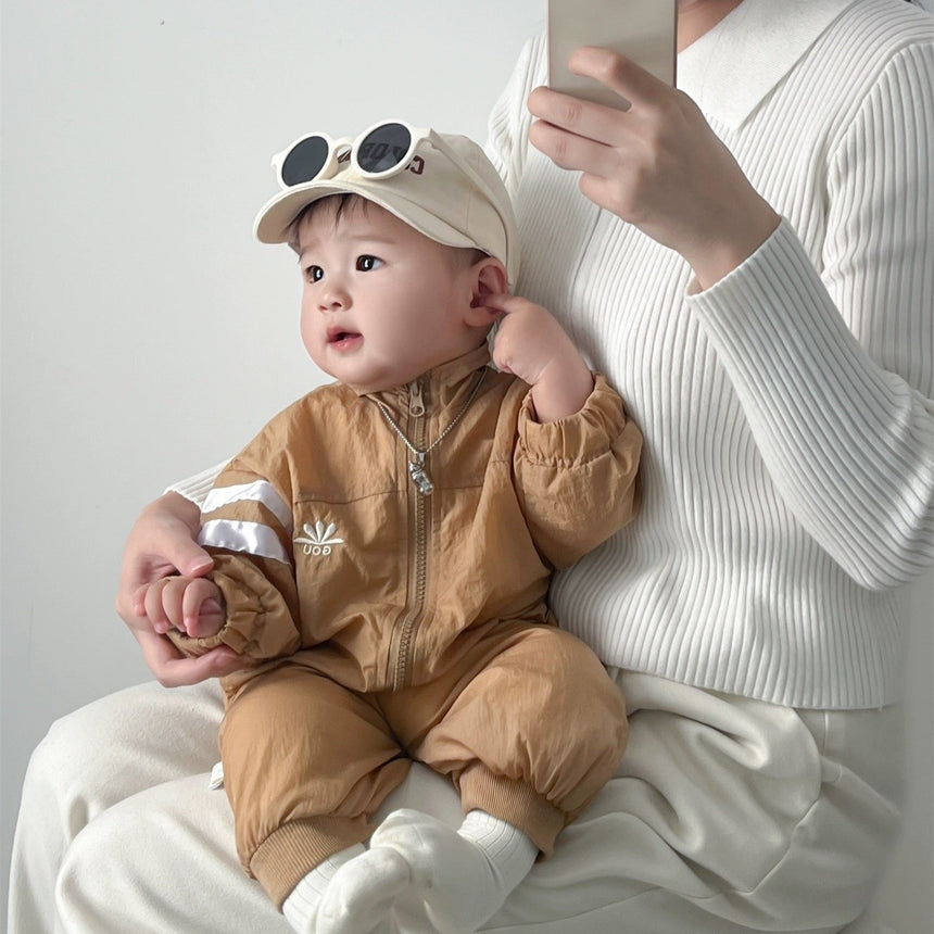 Baby wearing sporty zip-up romper – Little Explorer unisex baby gift set