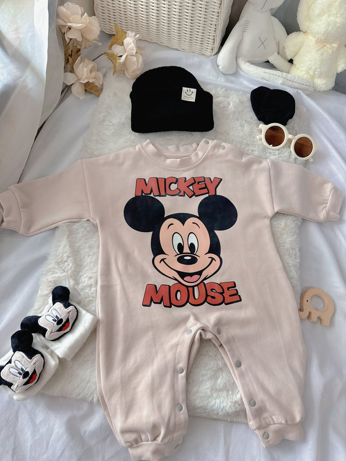 Mickey Pals baby outfit flat lay – mouse-print romper with black beanie