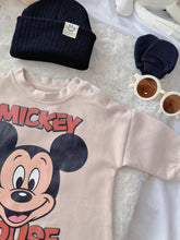 Mickey Pals baby outfit flat lay – mouse-print romper with black beanie