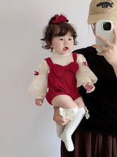 Baby wearing the Red Riding Hood red romper with puff sleeves, bows and red beret
