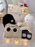 Tiny Trendsetter premium baby gift set in a rattan basket with khaki overalls with striped top and black beanie