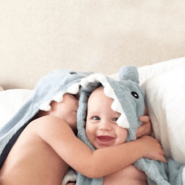 two babies in a shark garment