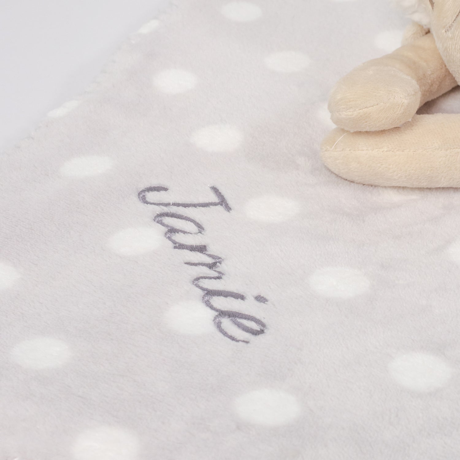 Close-up of the embroidered baby&