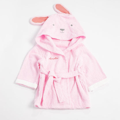 Flat lay of a pink bunny bathrobe with the name &